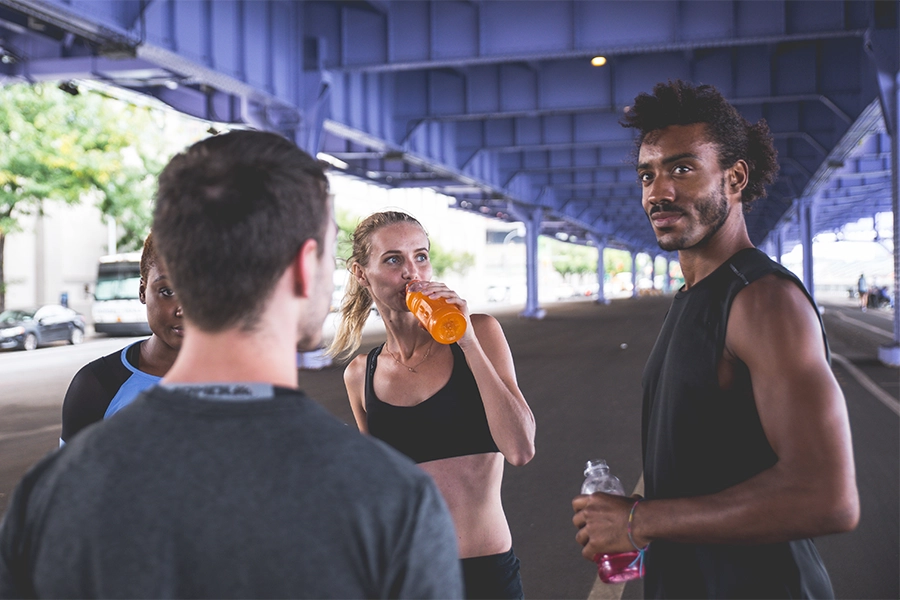Young people exercising and consuming functional beverages.