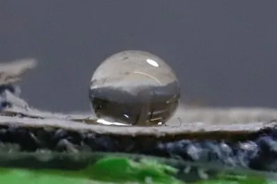 Water droplet on coated denim.