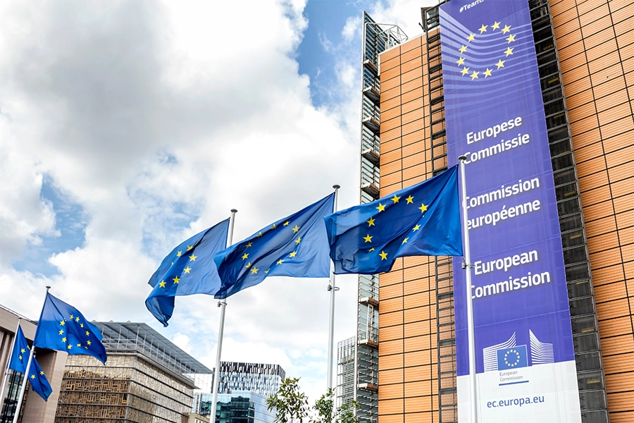 European Commission building with flags.