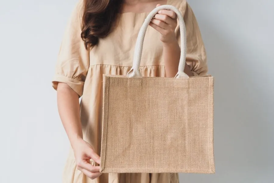 woman holding reusable bag