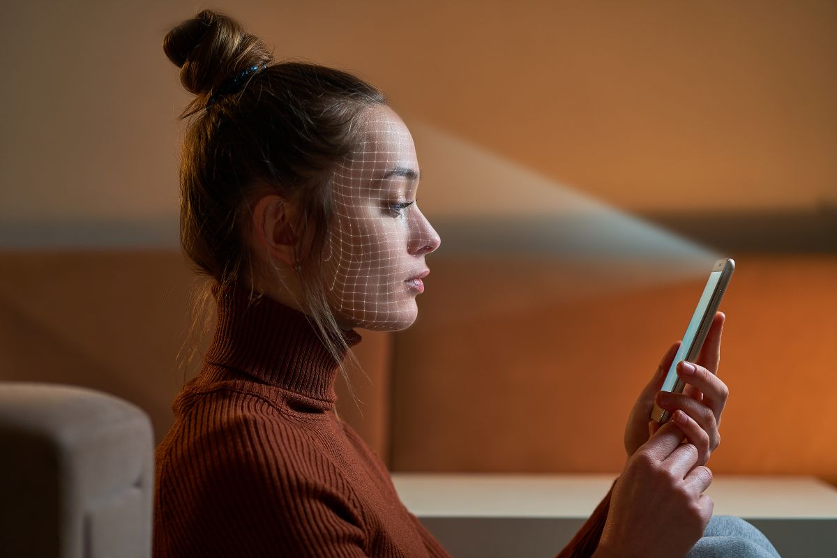 woman holding phone up to face