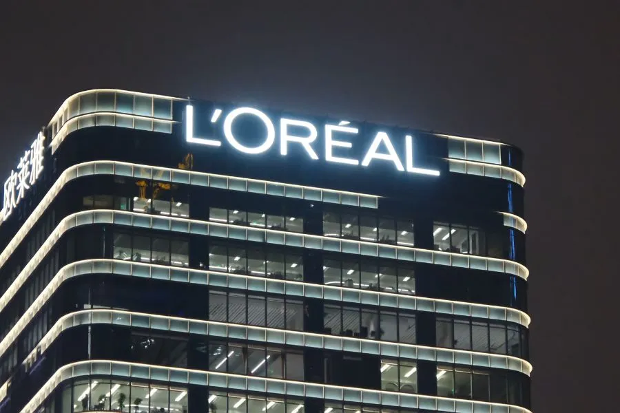Loreal logo on side of glass building.