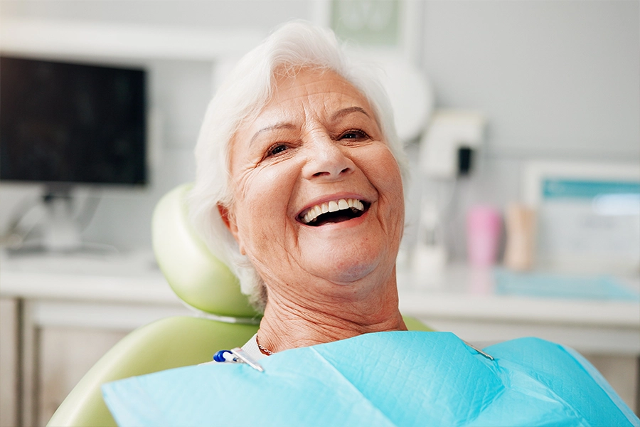 smiling senior woman at dentist