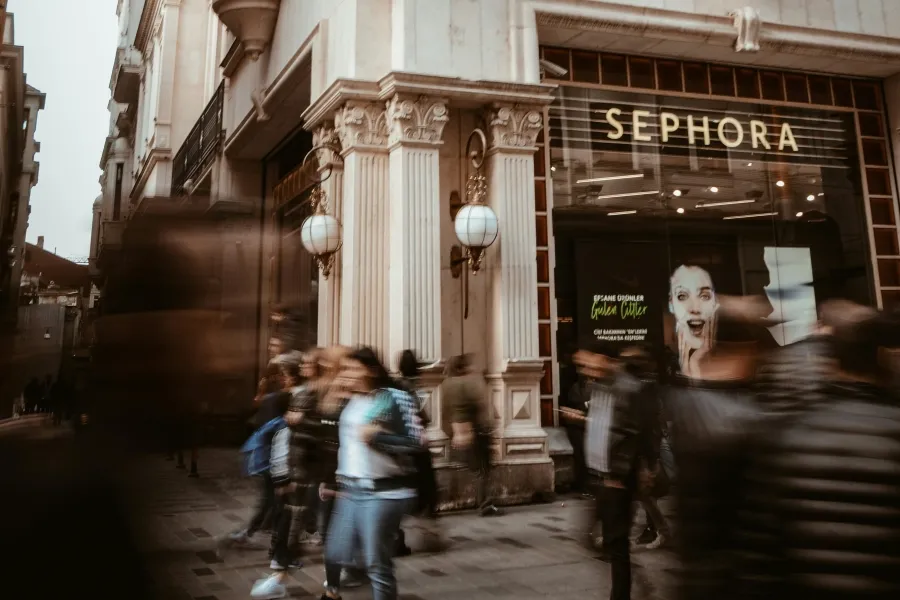 sephora logo with people walking