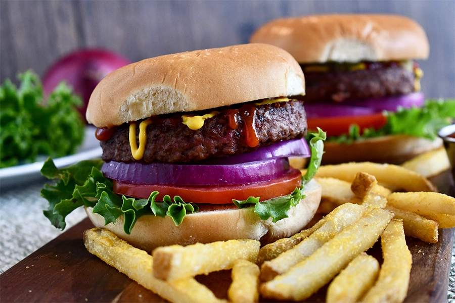 Plant-based based burgers with fries.