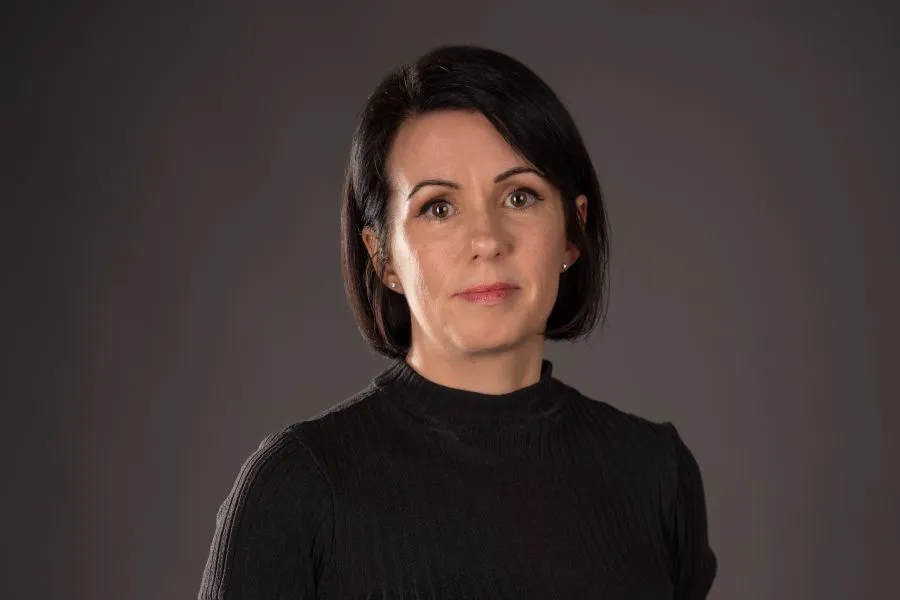 A woman looking into the camera.