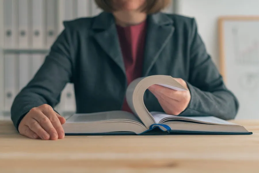 woman reading big book