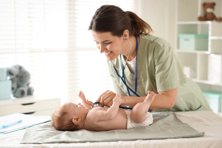 Doctor checking baby