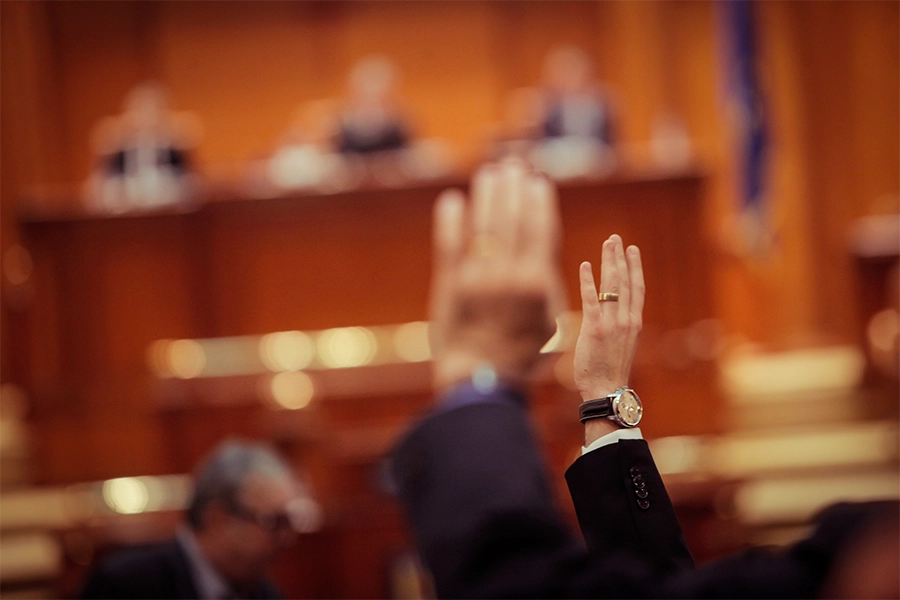 US senate voting on bill with raised hands.