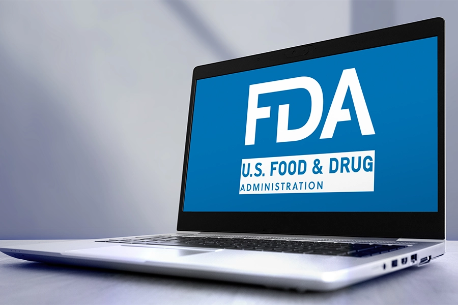 Laptop showing US FDA logo.