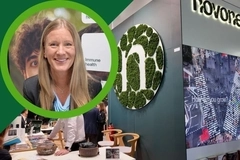 Vitafoods 2026 Novonesis video thumbnail: Smiling woman highlighted over the Novonesis booth display Vitafoods 2026 Novonesis video thumbnail: Smiling woman highlighted over the Novonesis booth display