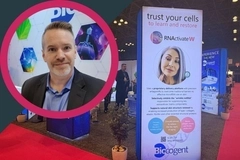 Image NYSCC 2026 Biocogent video thumbnail: Man at Biocogent trade show booth with RNActivate display promoting cellular skin restoration technology