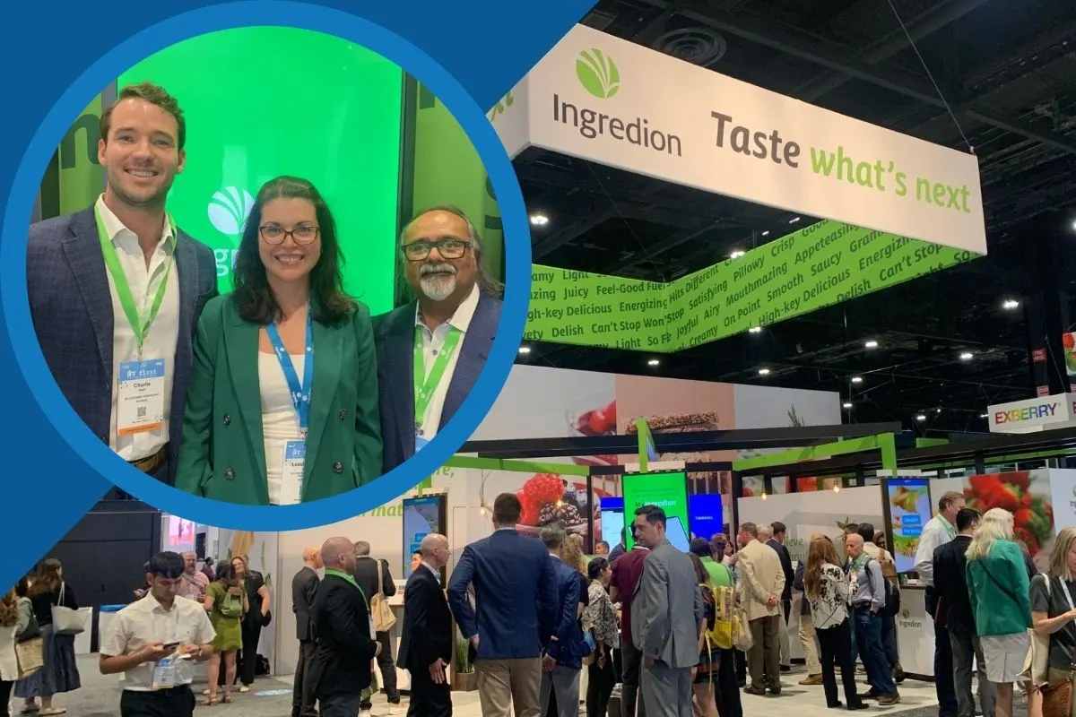 IFT First 2026 Ingredion video thumbnail: Ingredion trade show booth crowded with attendees, with three smiling representatives featured in a circular inset